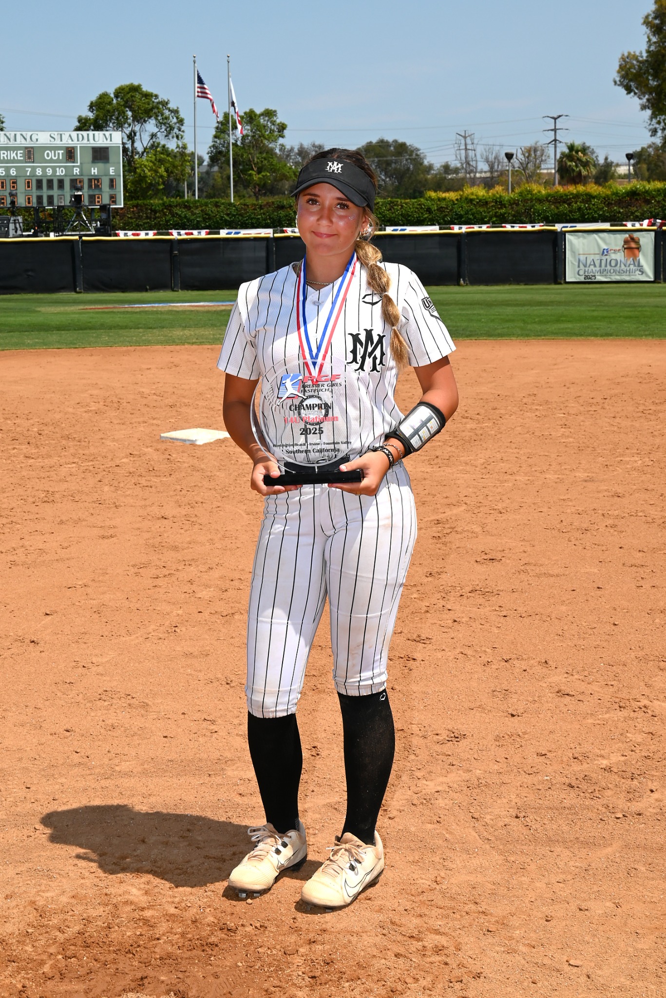 Macie Romano holding her championship award